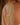 Silver chain necklace on a person's back with a blurred background